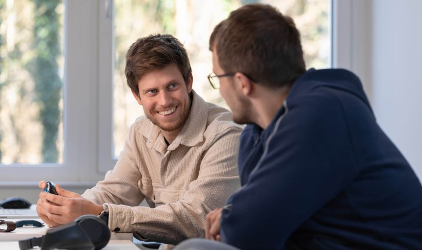 two men working at a desk