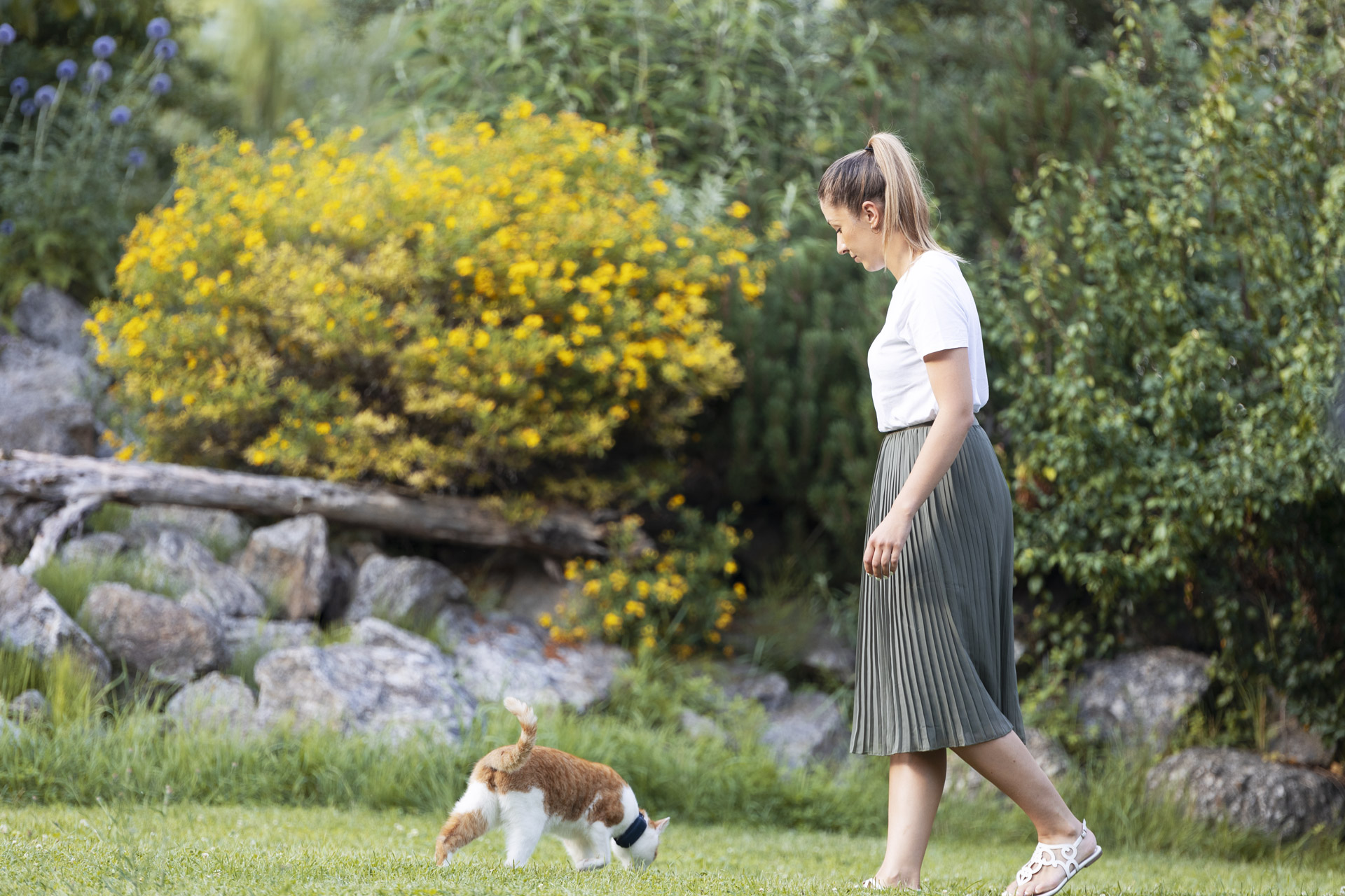 woman and cat walking outside