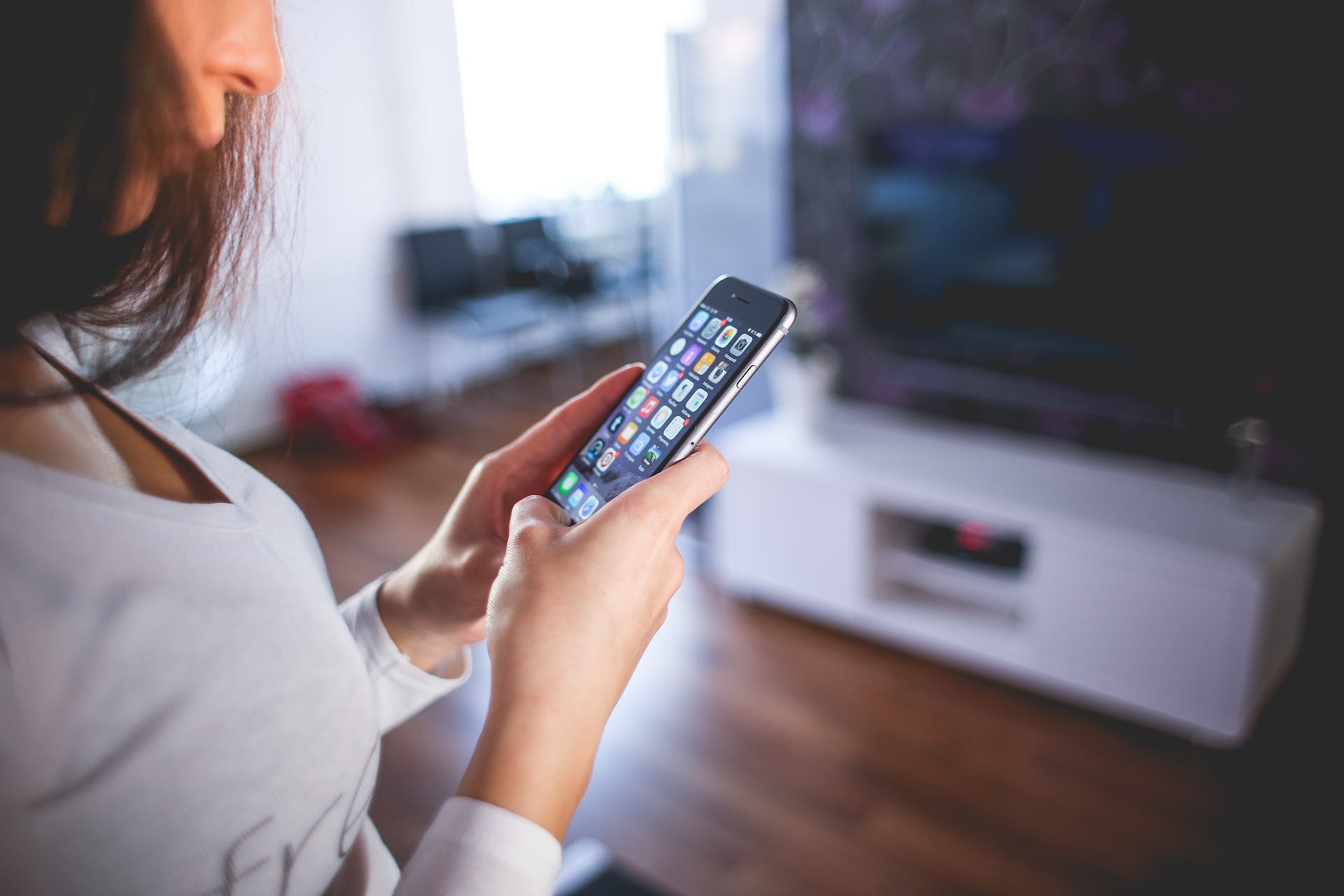 A woman checking her iPhone screen