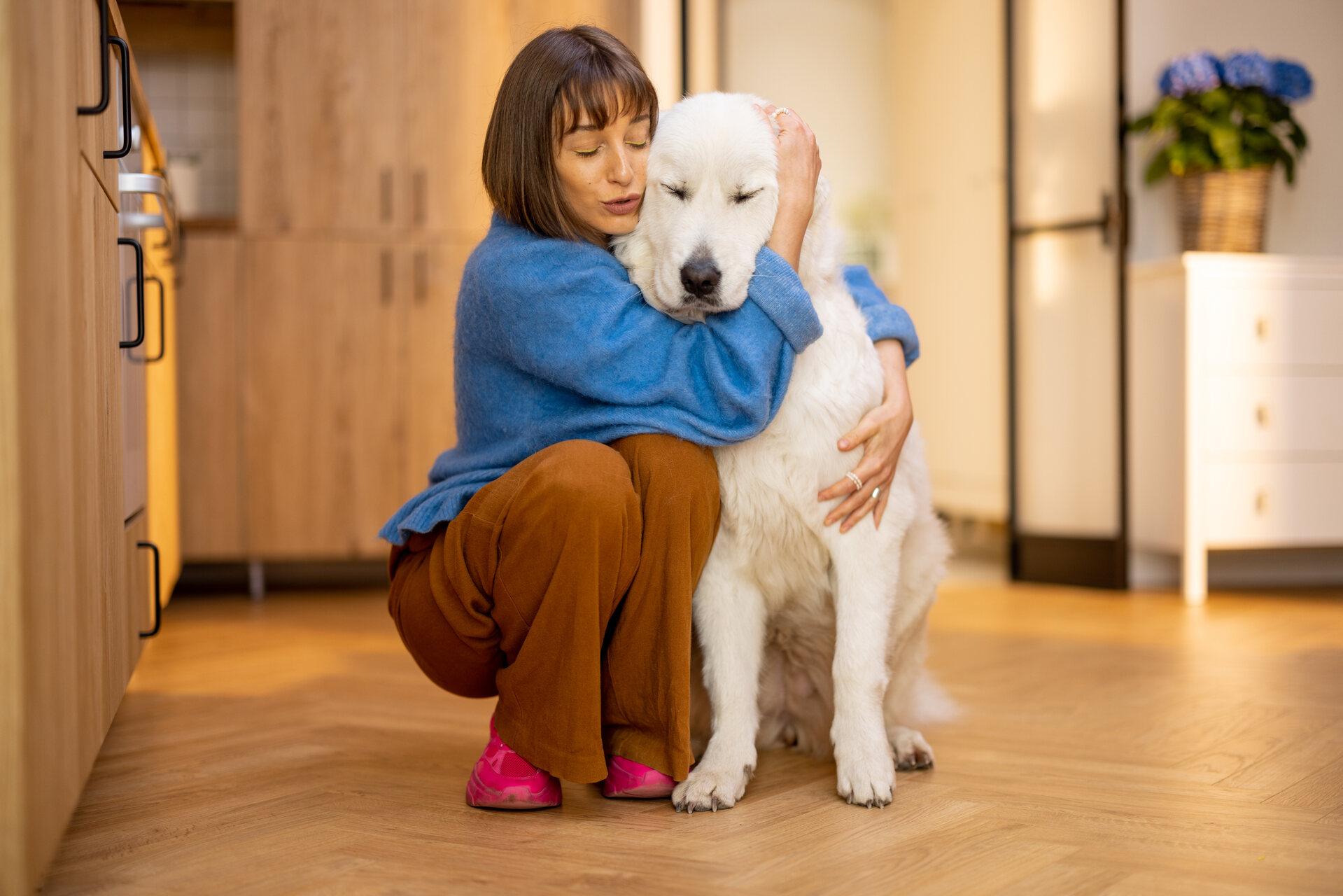 A woman hugging a dog