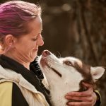 A woman hugging a dog