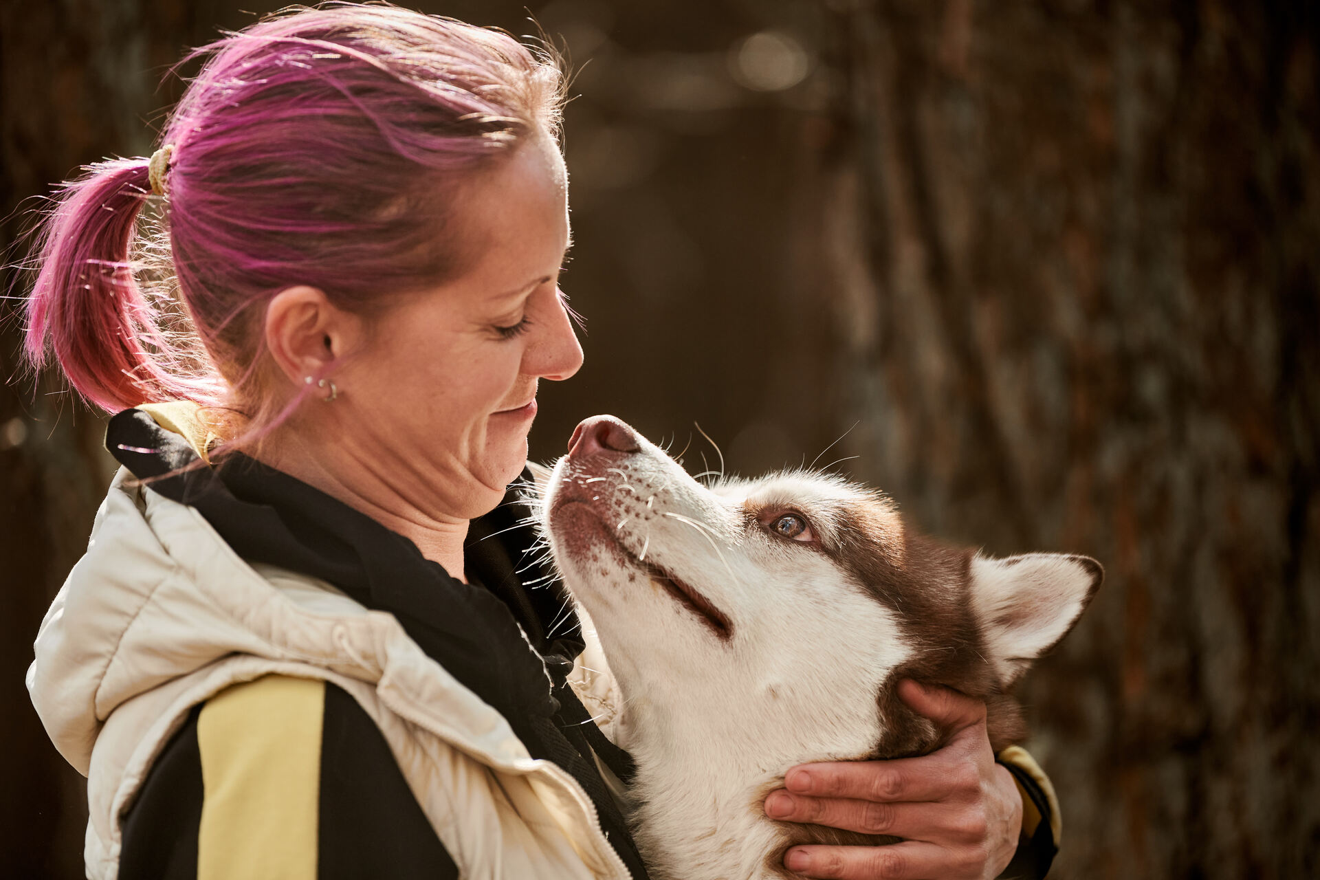 A woman hugging a dog